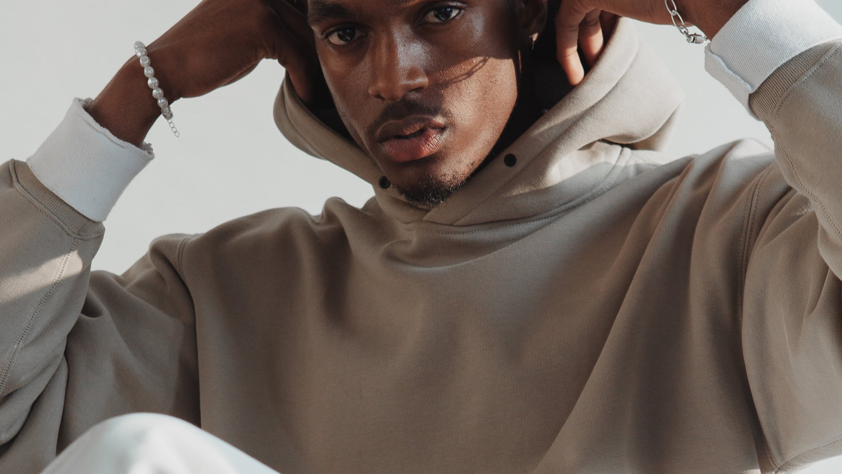 man-in-white-and-light-tan-outfit.jpg
